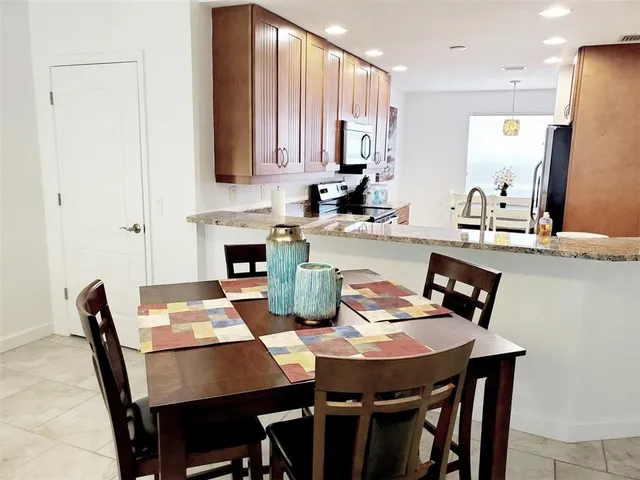 a view of a dining room with furniture