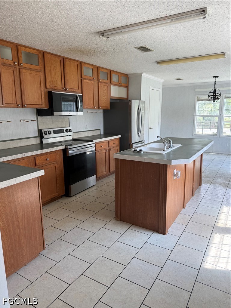 1660 Evans Road LaBelle, FL 33935 - Photo 2 of 10 a kitchen with stainless steel appliances granite countertop a stove a sink dishwasher and a refrigerator