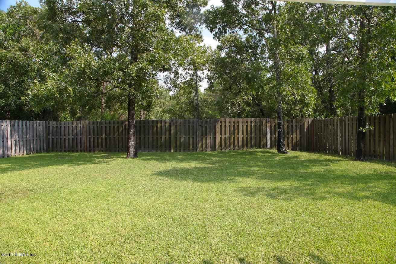 4308 Rye Court St. Johns, FL 32259 - Photo 18 of 18 a garden view with wooden fence