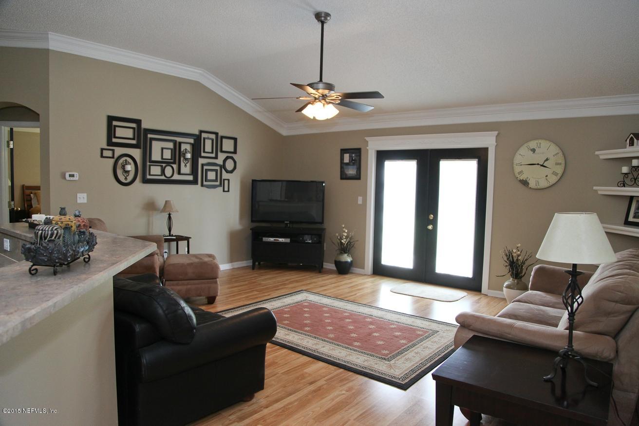 4308 Rye Court St. Johns, FL 32259 - Photo 2 of 18 a living room with furniture a rug and a window