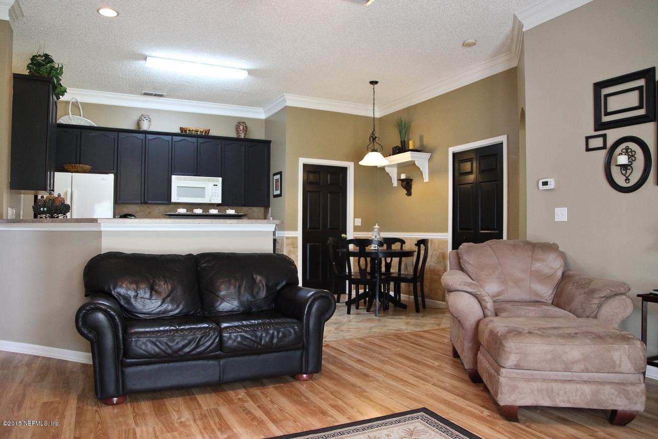 4308 Rye Court St. Johns, FL 32259 - Photo 3 of 18 a living room with furniture and a fireplace