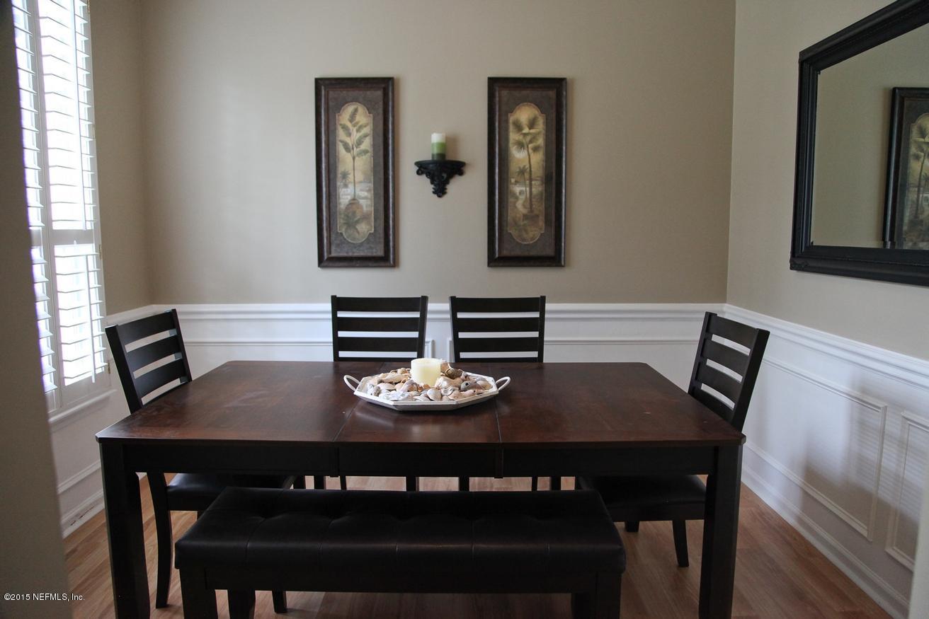 4308 Rye Court St. Johns, FL 32259 - Photo 4 of 18 a view of a dining room with furniture and wooden floor