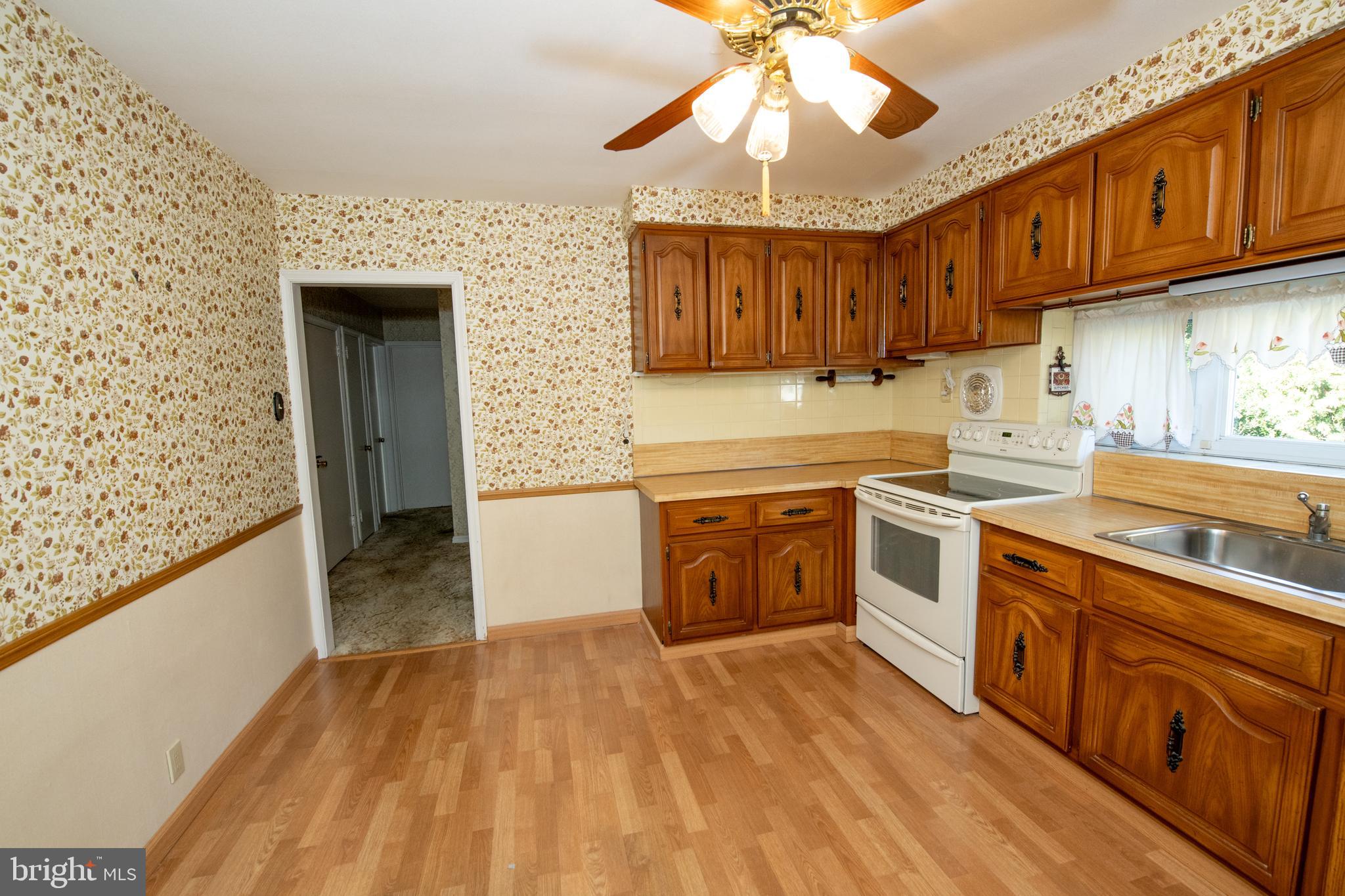 2052 Clinton Road Huntingdon Valley, PA 19006 - Photo 25 of 61 a kitchen with stainless steel appliances granite countertop a sink and cabinets