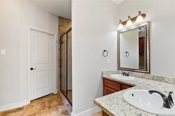 a bathroom with a sink and a mirror