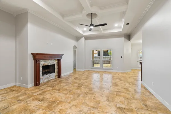 a view of an empty room with a fireplace