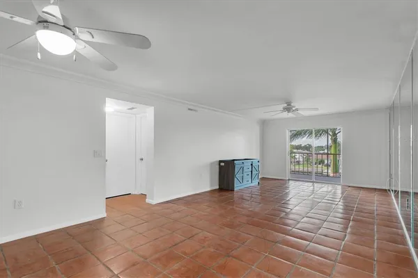 a view of an empty room with a window