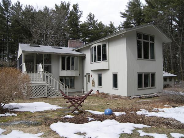 35 Garner Road Stow, MA 01775 - Photo 13 of 16 a front view of a house with a yard and seating space