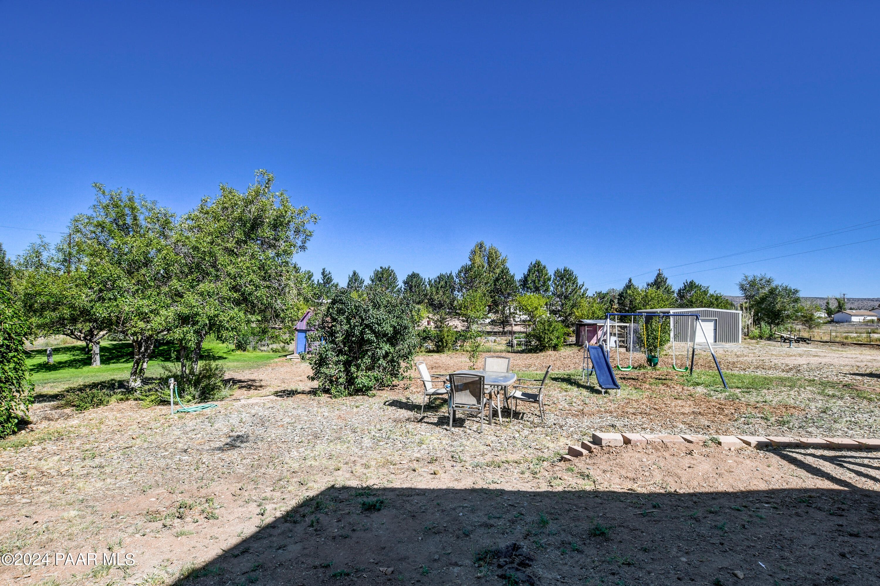 24900 North Mitchell Road Paulden, AZ 86334 - Photo 28 of 46 a view of a yard with a tree