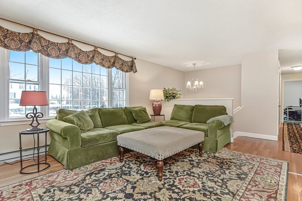 37 Hazen Road Shirley, MA 01464 - Photo 9 of 40 a living room with furniture and a lamp