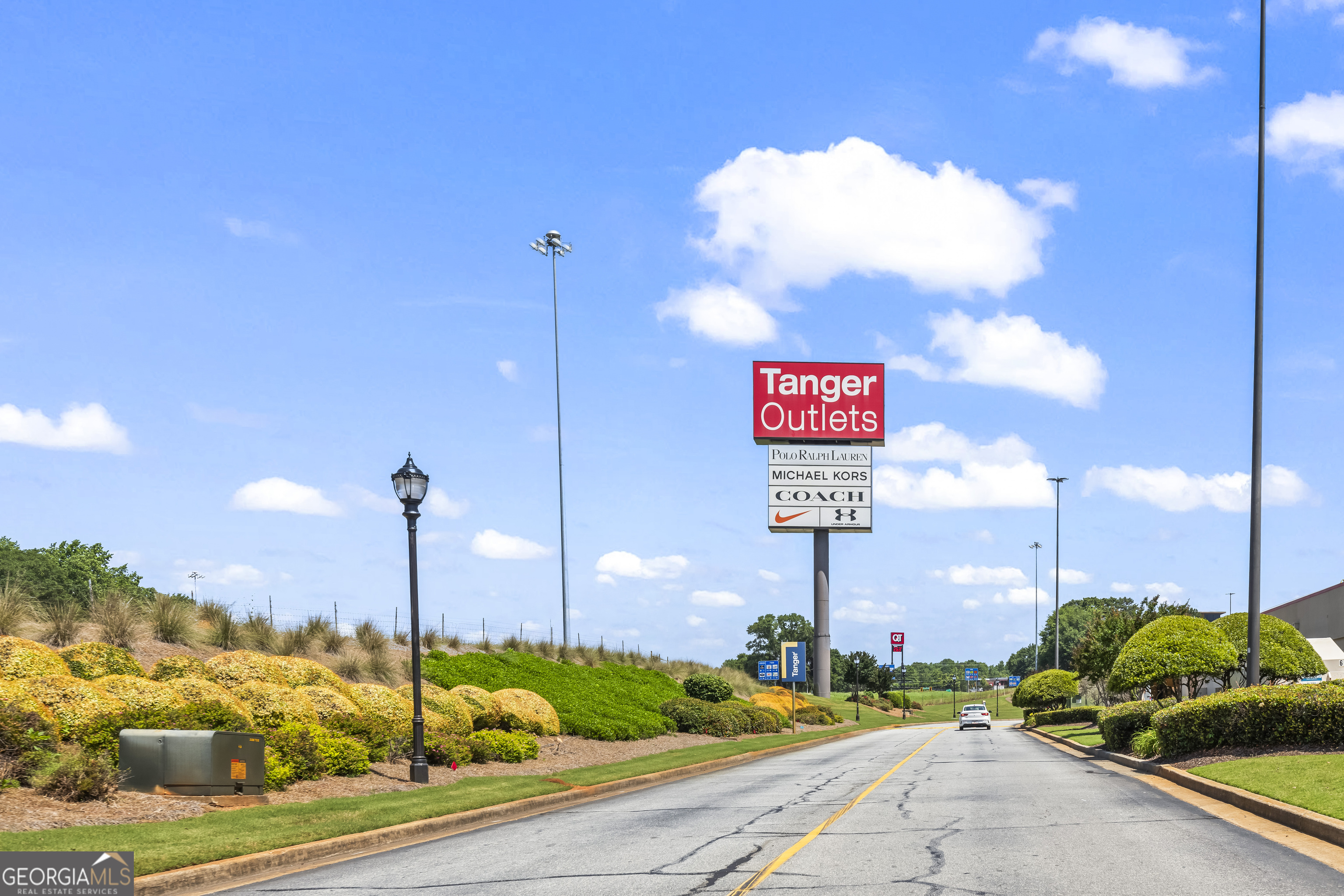 355 Chuli Road Griffin, GA 30223 - Photo 14 of 16 a sign board with buildings in the background