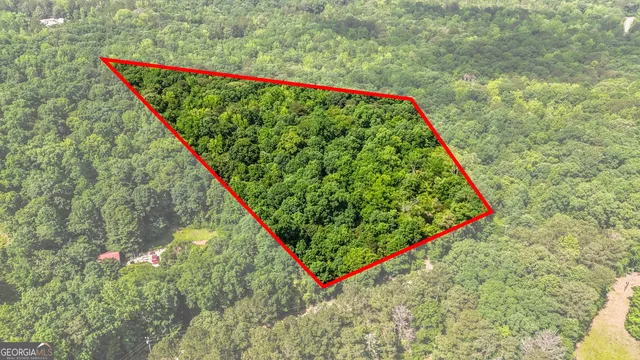 a backyard of a house with a yard and outdoor seating