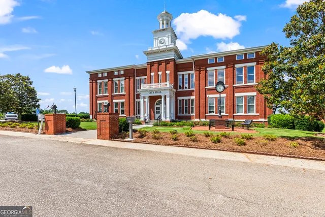a view of a backyard with sitting area