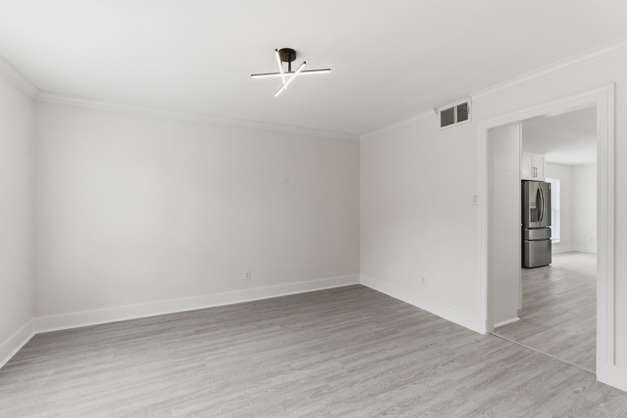 13811 Menasco Court Houston, TX 77077 - Photo 12 of 50 Another angle of the formal dining room shows you can access the kitchen from this room.