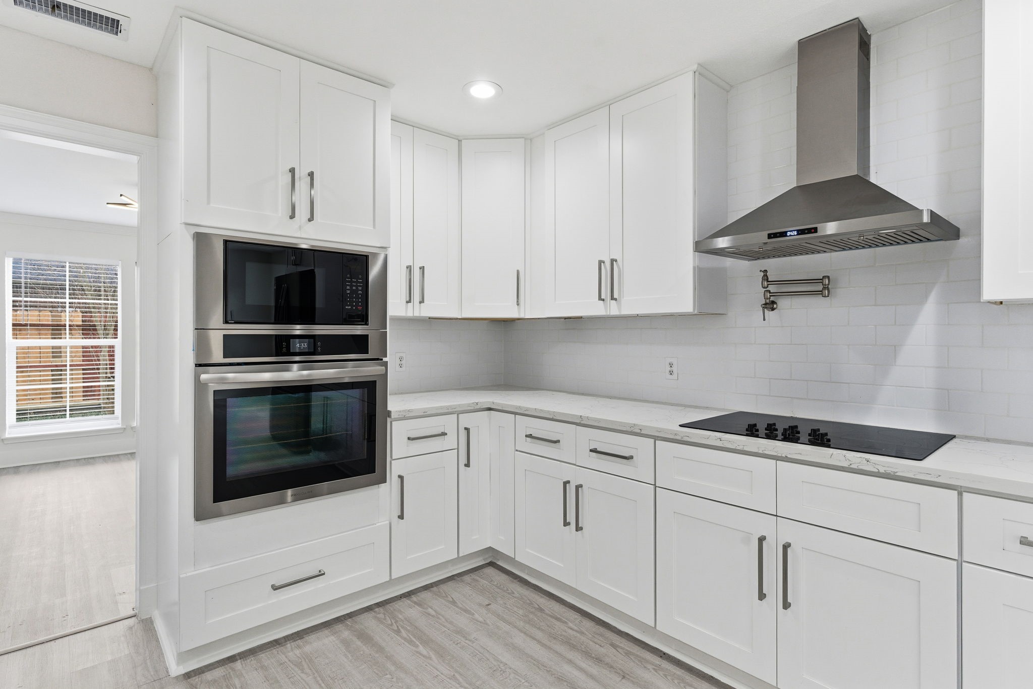 13811 Menasco Court Houston, TX 77077 - Photo 17 of 50 All shaker style cabinets and drawers have hardware and are soft closing with tile backsplash.