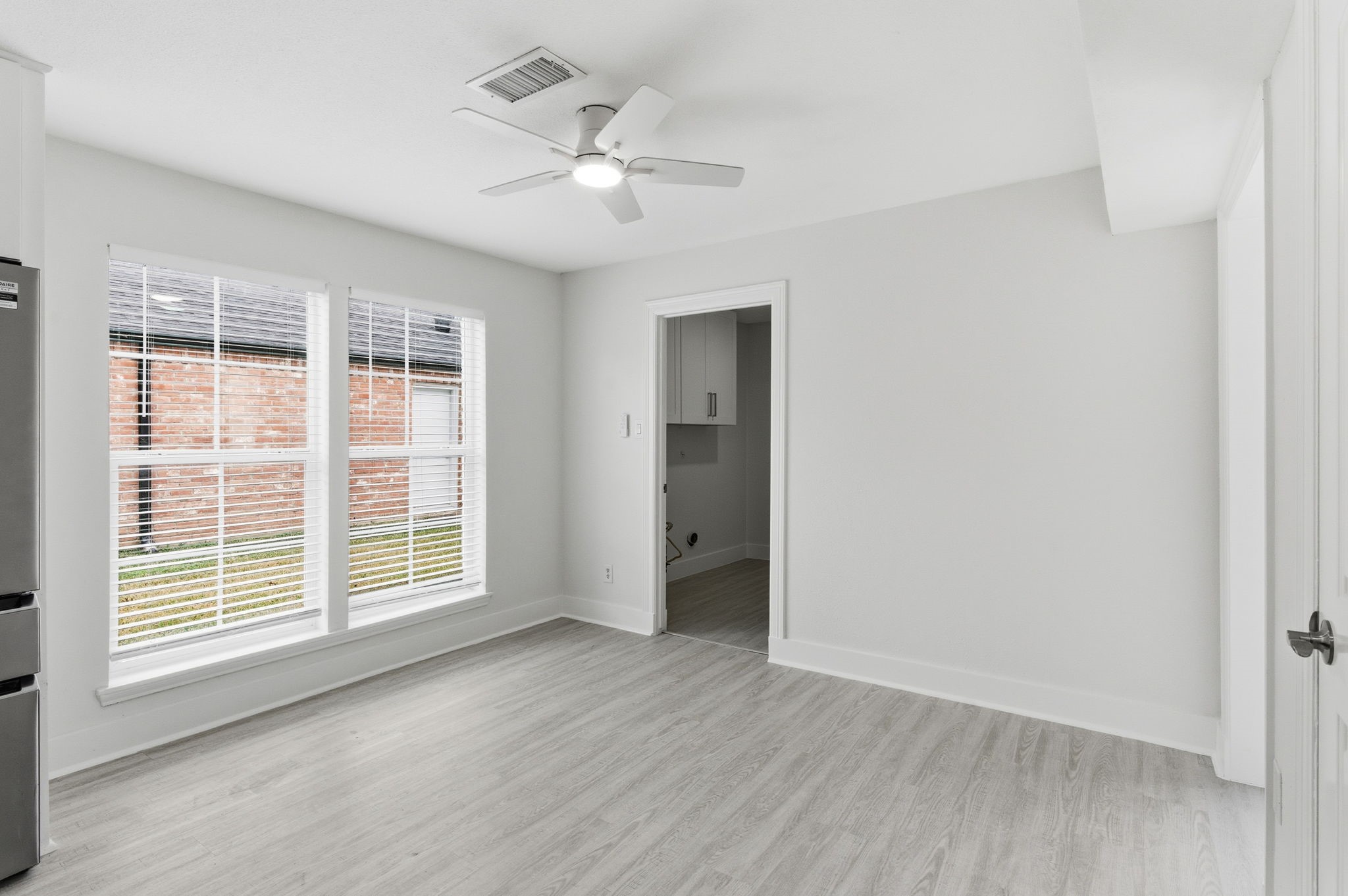 13811 Menasco Court Houston, TX 77077 - Photo 22 of 50 The breakfast room is located just off to the side of the kitchen with a ceiling fan. The utility room can be accessed from this room.