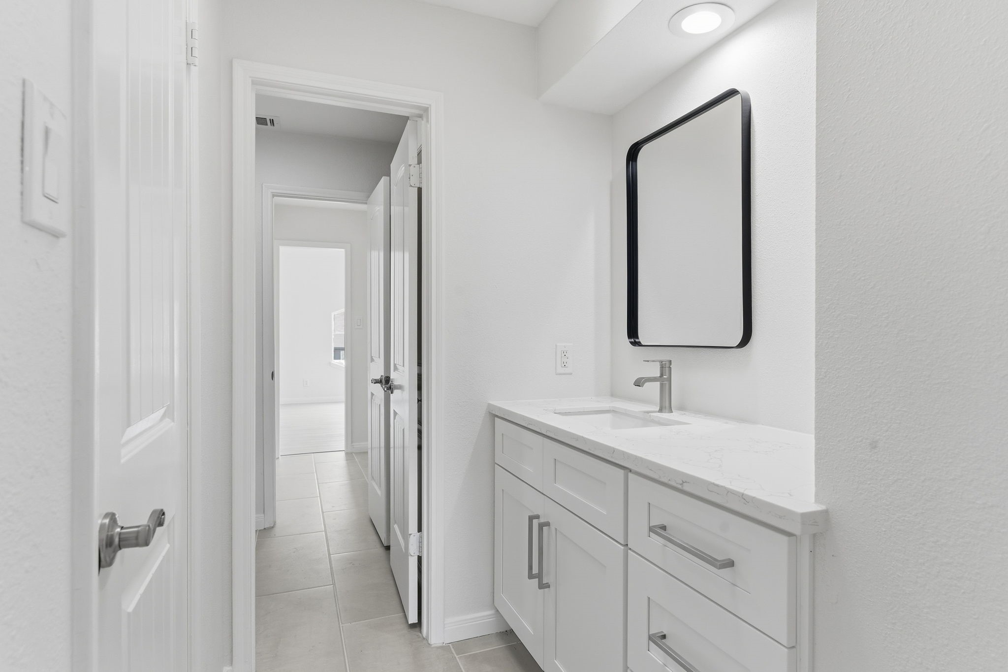 13811 Menasco Court Houston, TX 77077 - Photo 37 of 50 The other vanity for bedroom #3 shows the updated soft closing cabinets and drawers with hardware.