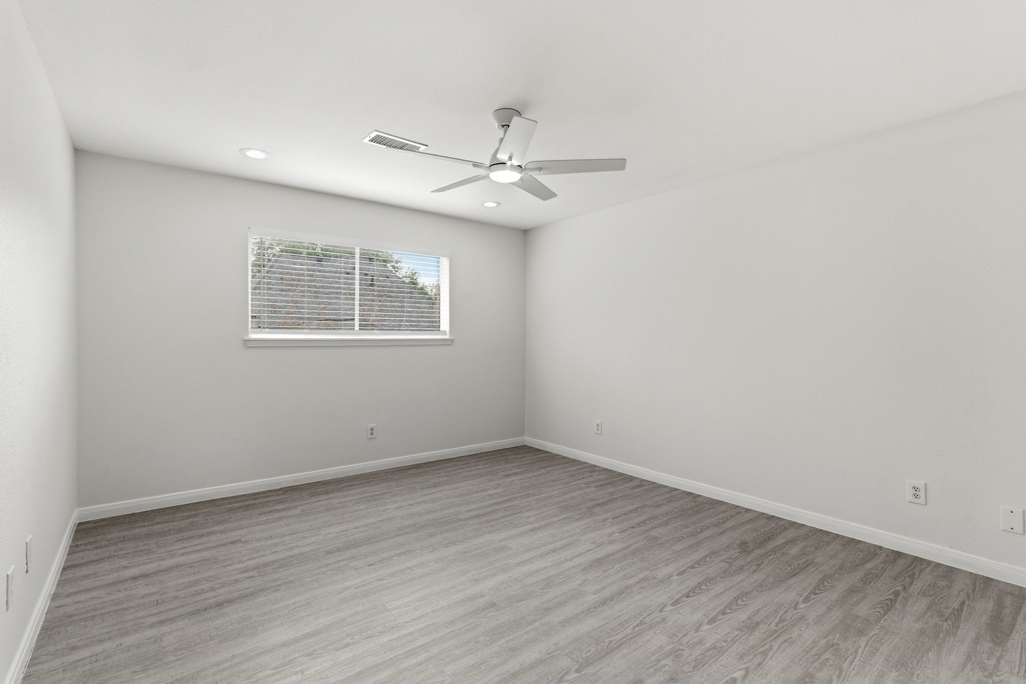 13811 Menasco Court Houston, TX 77077 - Photo 39 of 50 Bedroom #3 also features a ceiling fan, LED recessed lighting, luxury vinyl plank floors and a nice size closet.