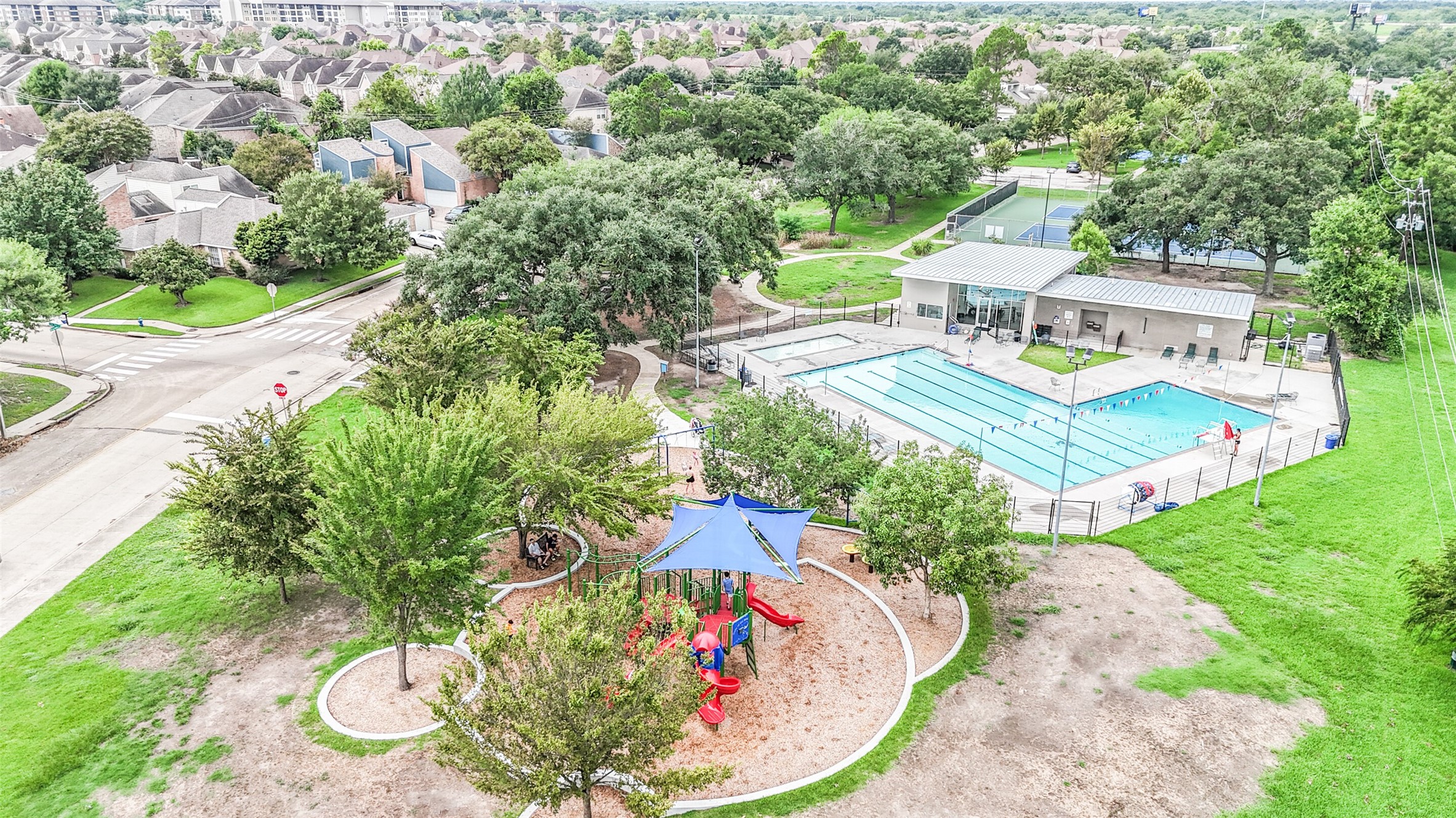 13811 Menasco Court Houston, TX 77077 - Photo 45 of 50 The playground is next to a big field where you can picnic, kick a soccer ball around, play tag, etc.
