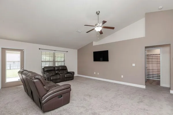 a living room with furniture and a window