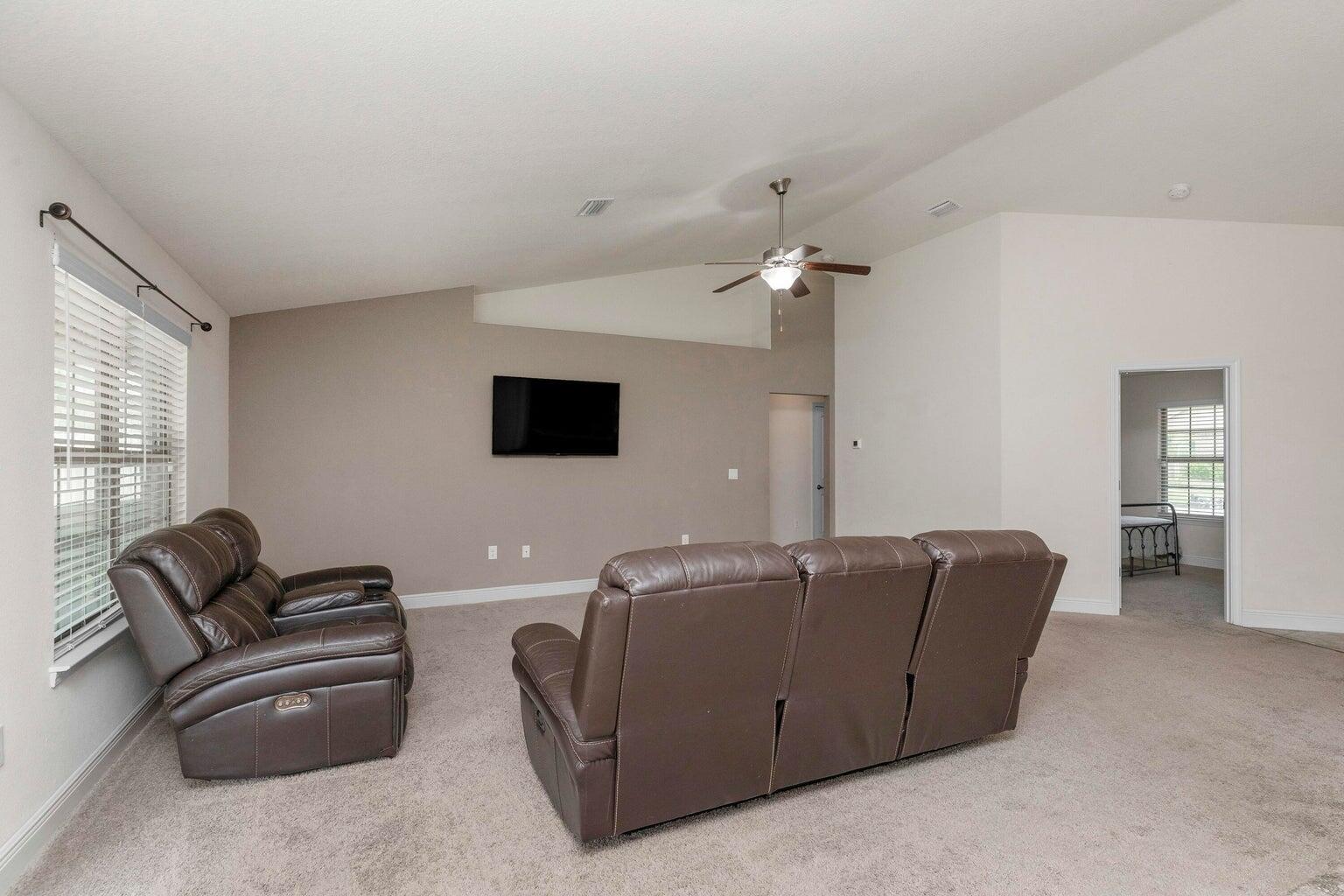 2365 Genevieve Way Crestview, FL 32536 - Photo 16 of 33 a living room with furniture and a flat screen tv