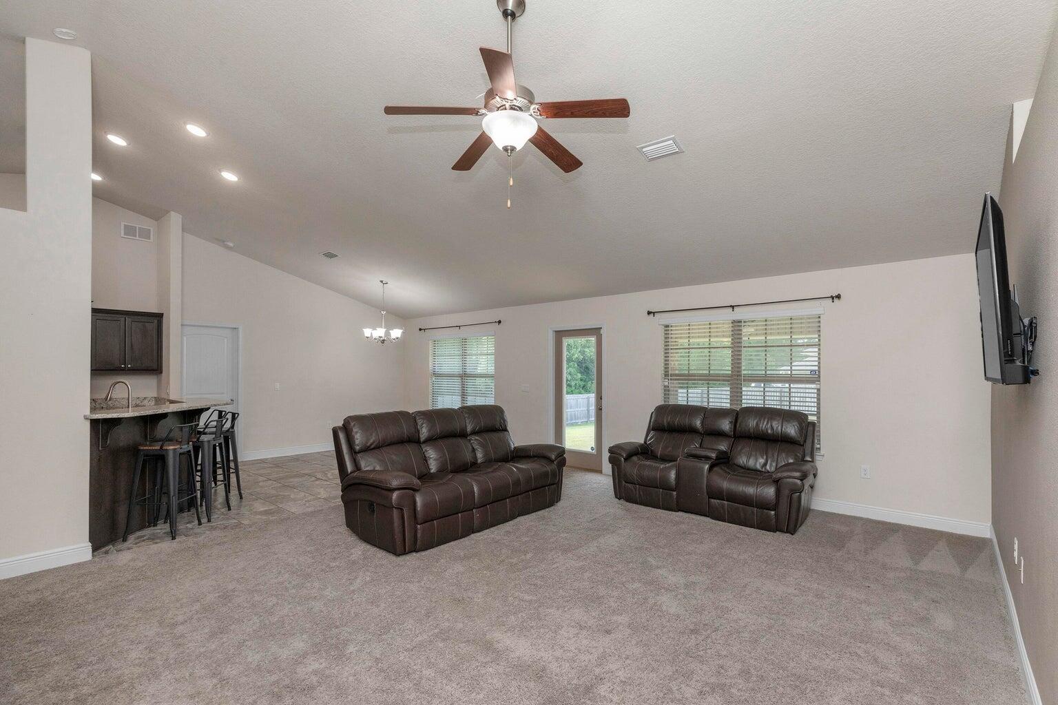 2365 Genevieve Way Crestview, FL 32536 - Photo 17 of 33 a living room with furniture ceiling fan and a window