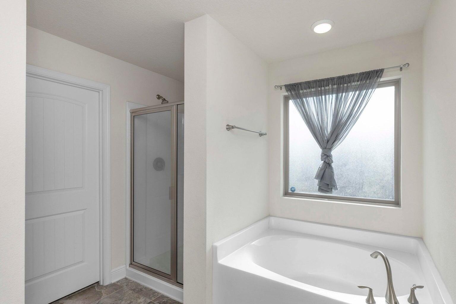 2365 Genevieve Way Crestview, FL 32536 - Photo 23 of 33 a white bath tub sitting next to a window