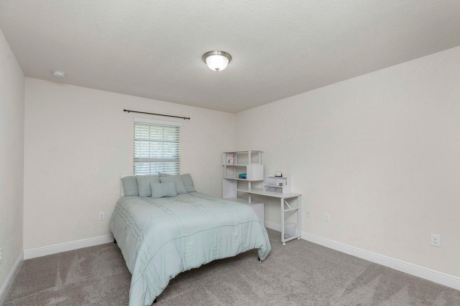 2365 Genevieve Way Crestview, FL 32536 - Photo 26 of 33 a bedroom with a bed and a window