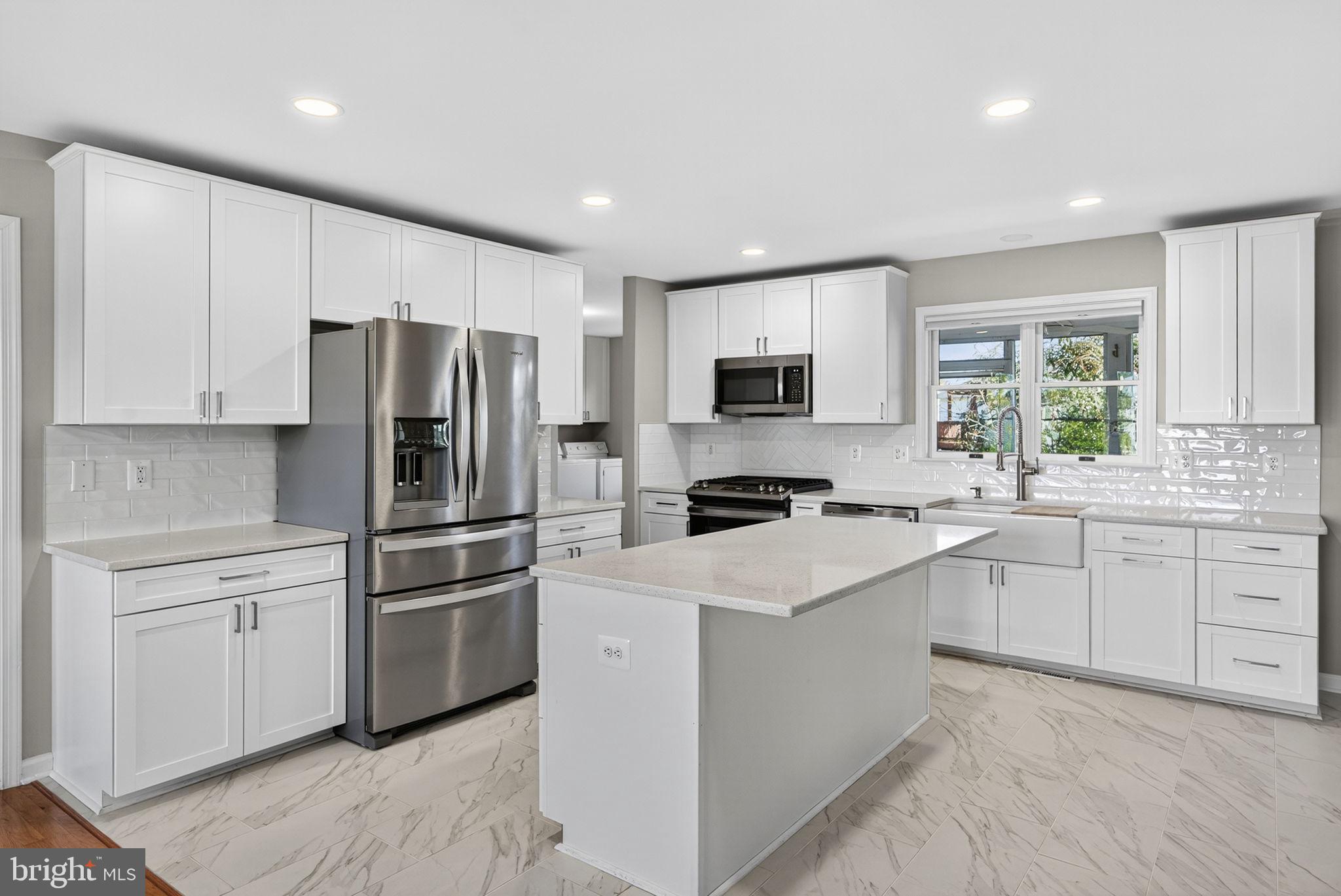 2140 6th Street Middletown, VA 22645 - Photo 11 of 62 a kitchen with cabinets stainless steel appliances and window
