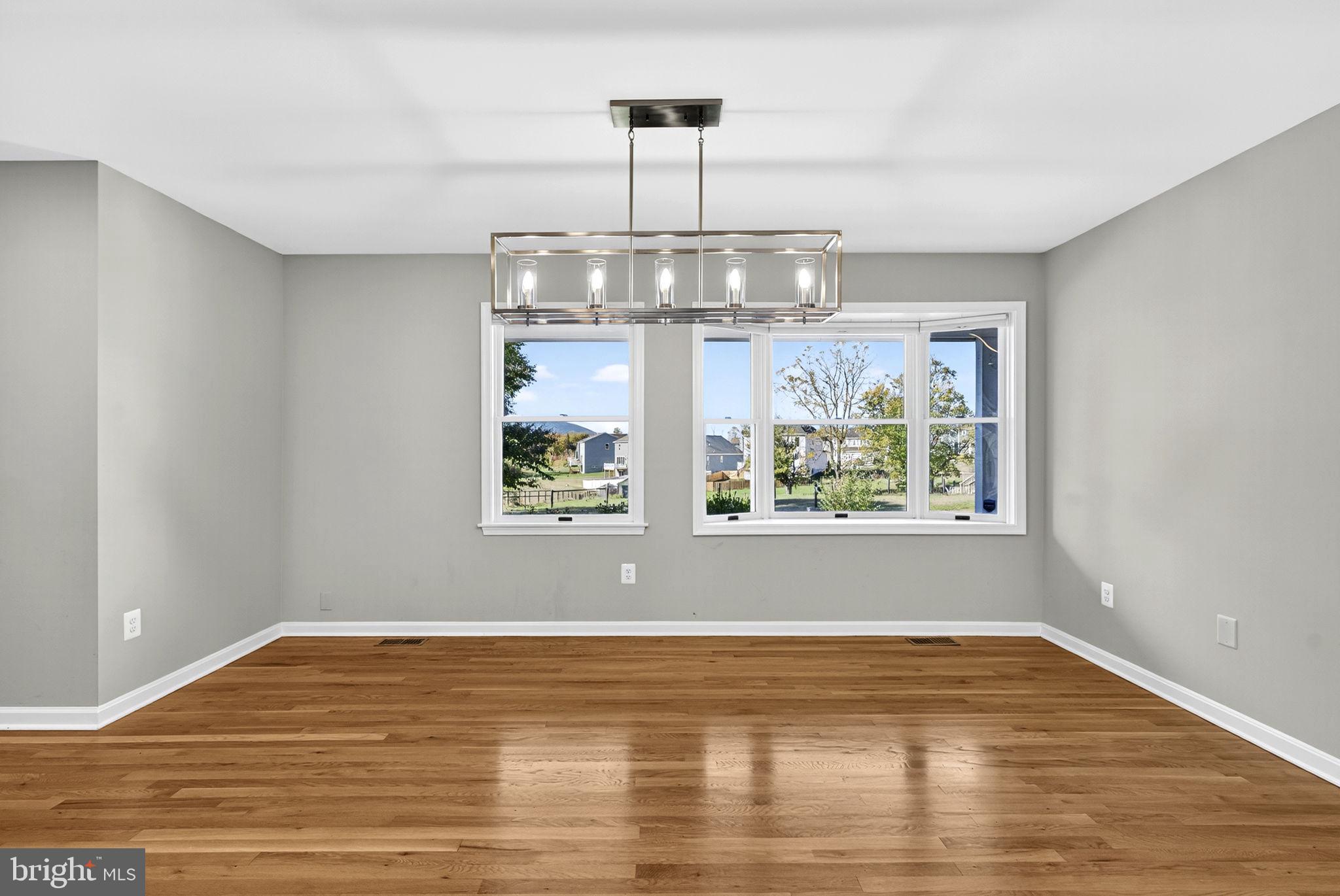 2140 6th Street Middletown, VA 22645 - Photo 14 of 62 a view of empty room with wooden floor window and outdoor view