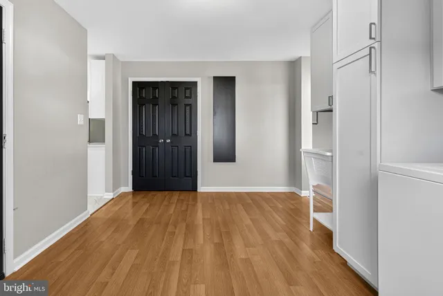 a view of a livingroom with a ceiling fan and window