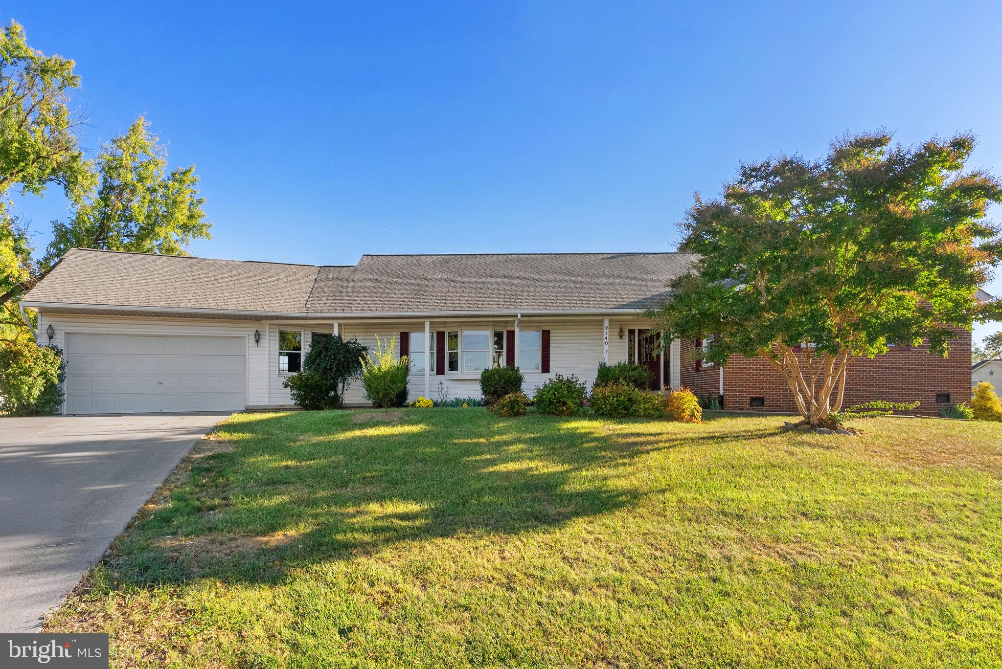 2140 6th Street Middletown, VA 22645 - Photo 2 of 62 a front view of a house with a yard