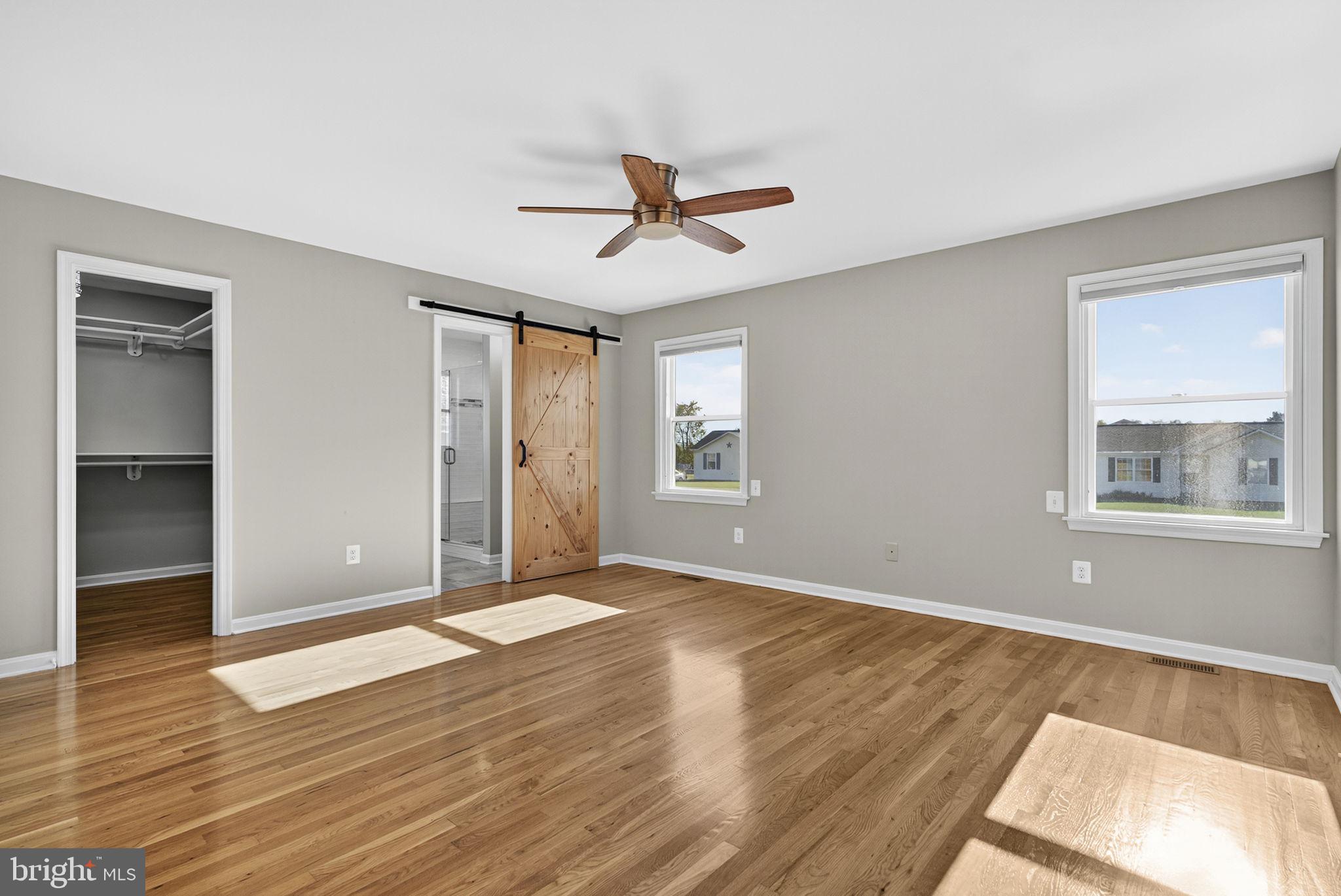 2140 6th Street Middletown, VA 22645 - Photo 24 of 62 wooden floor in an empty room with a window