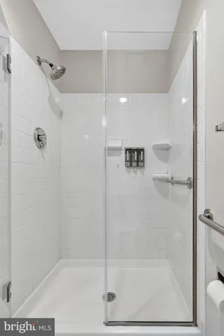 a kitchen with stainless steel appliances granite countertop a sink a refrigerator and a stove top oven