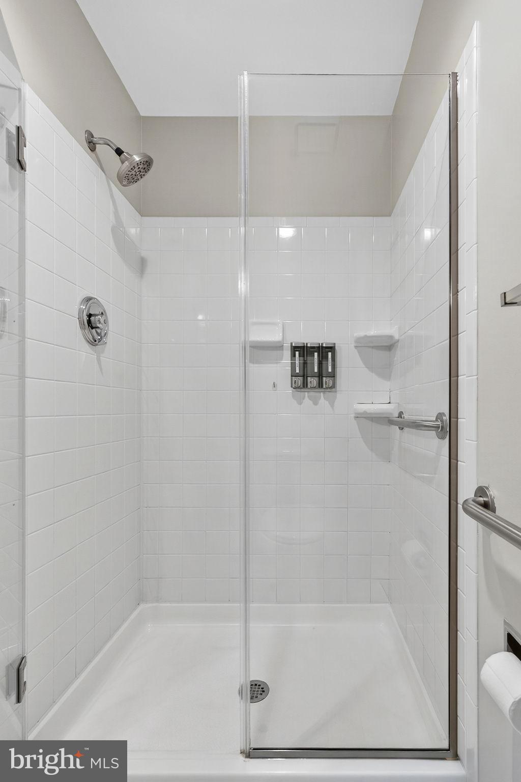 2140 6th Street Middletown, VA 22645 - Photo 35 of 62 a bathroom with a glass shower door