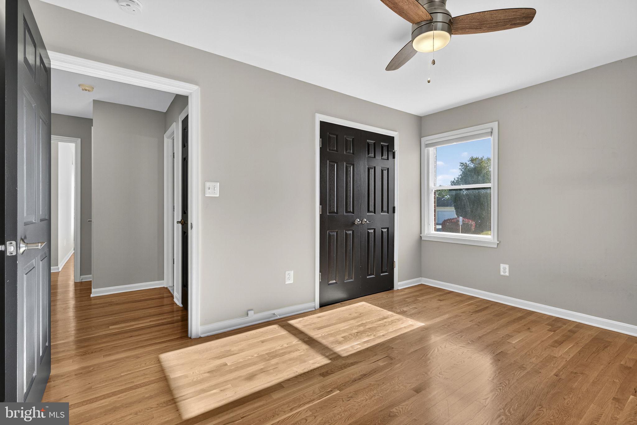 2140 6th Street Middletown, VA 22645 - Photo 37 of 62 a bedroom with a bed and wooden floor
