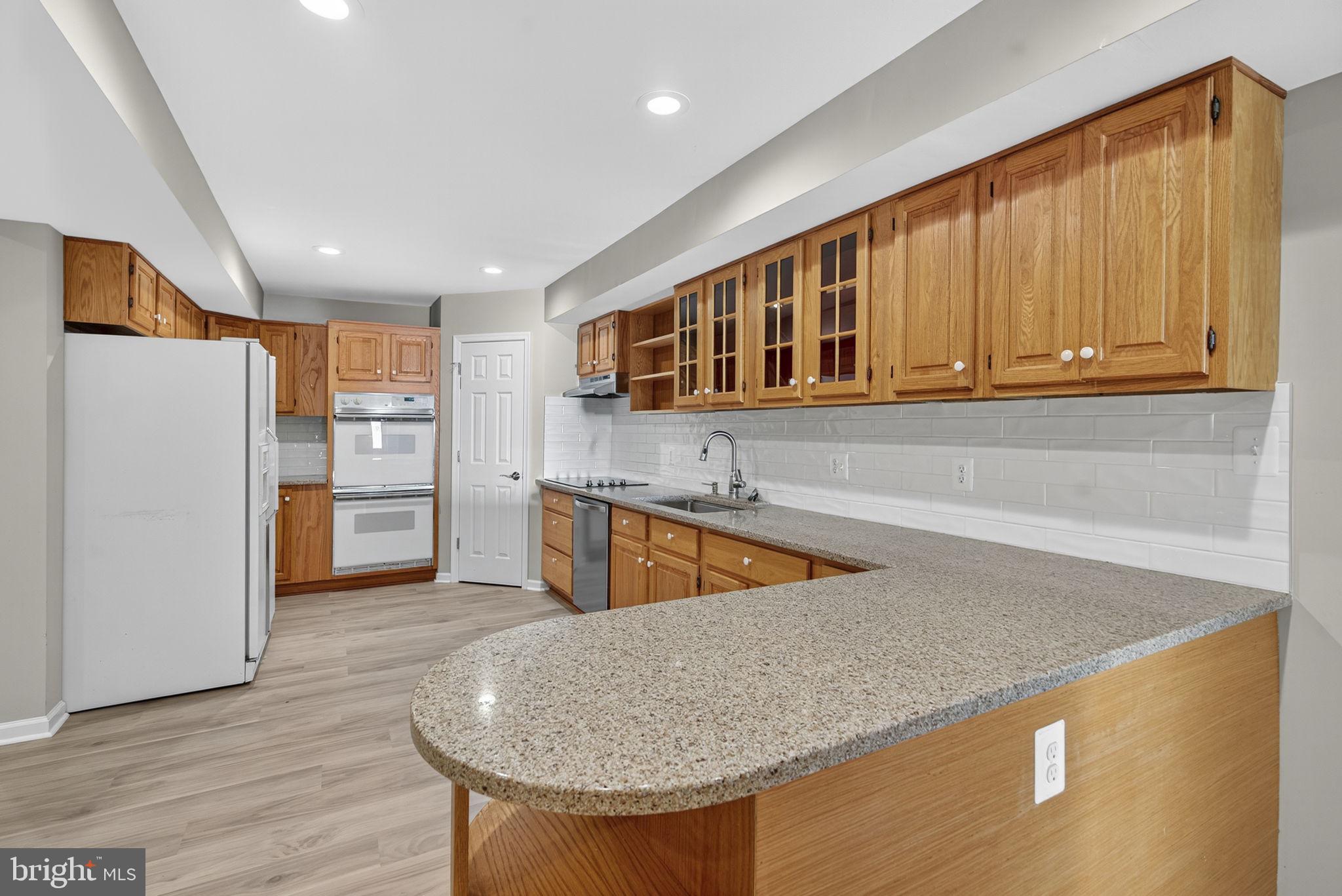 2140 6th Street Middletown, VA 22645 - Photo 43 of 62 a kitchen with stainless steel appliances granite countertop a sink a refrigerator and a stove top oven