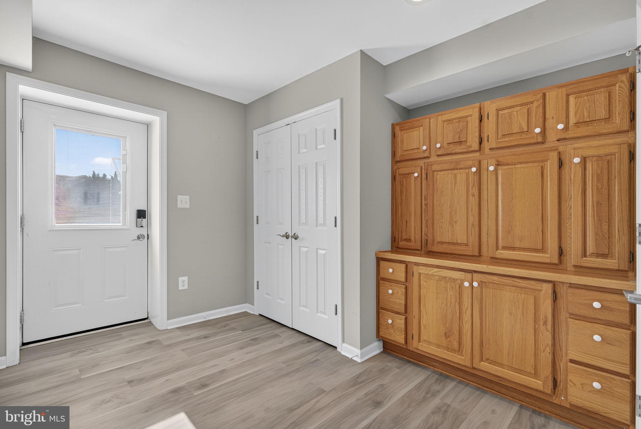 2140 6th Street Middletown, VA 22645 - Photo 48 of 62 an empty room with wooden floor and cabinet
