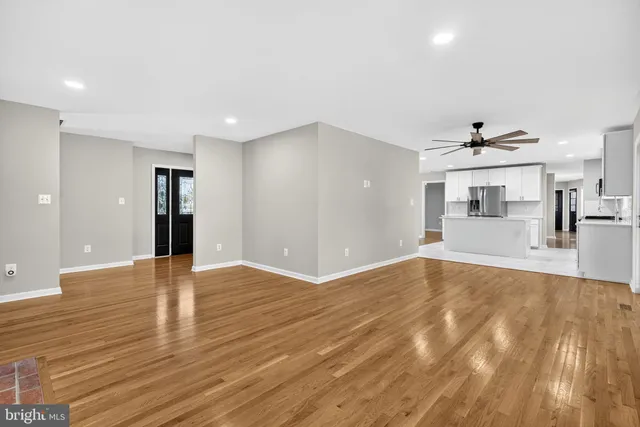 a view of a kitchen with a sink and cabinets