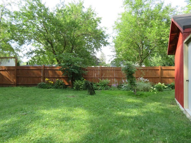 a view of a backyard with a garden