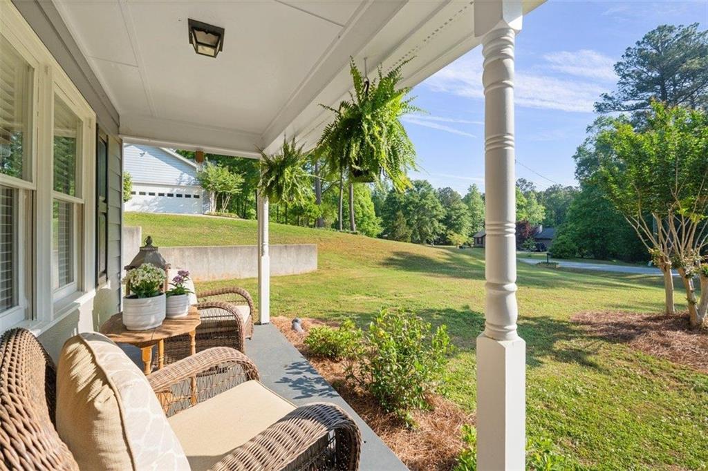 2777 Chickadee Drive Monroe, GA 30655 - Photo 5 of 36 a view of a patio with lawn chairs next to a yard
