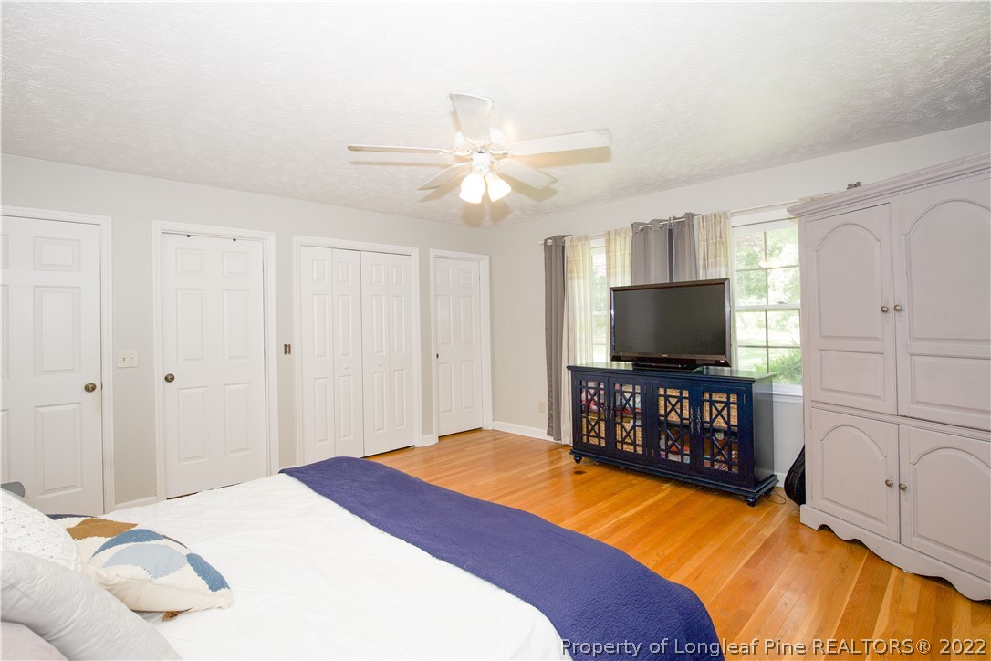 327 Scott Road Cameron, NC 28326 - Photo 20 of 48 a bedroom with a bed and a flat screen tv