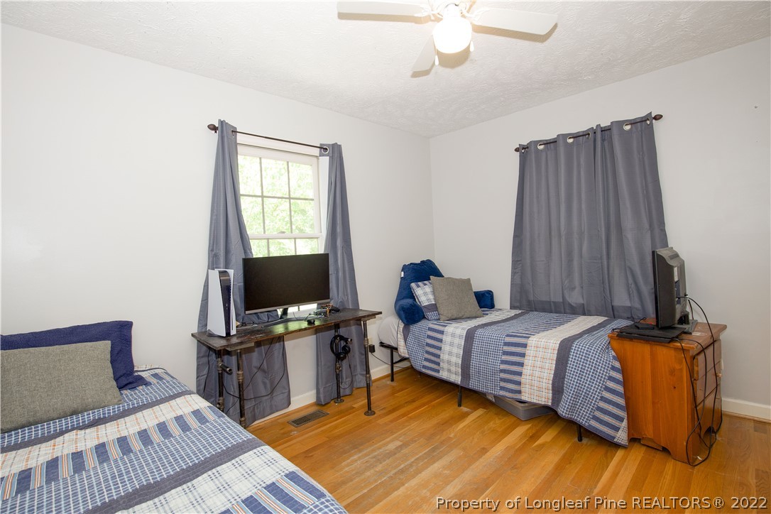 327 Scott Road Cameron, NC 28326 - Photo 33 of 48 a bedroom with bed and a window
