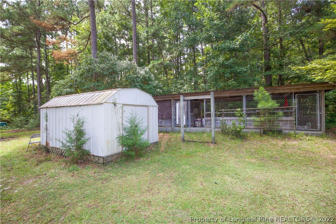 327 Scott Road Cameron, NC 28326 - Photo 45 of 48 a backyard of a house with table and chairs