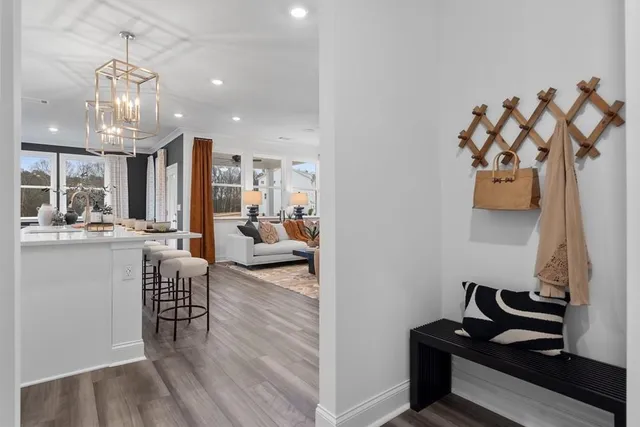 a view of a kitchen with stainless steel appliances granite countertop a stove and a refrigerator