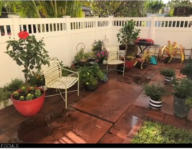 a view of a chairs and table in a patio