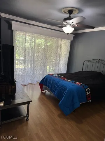 a bedroom with a large bed and a window