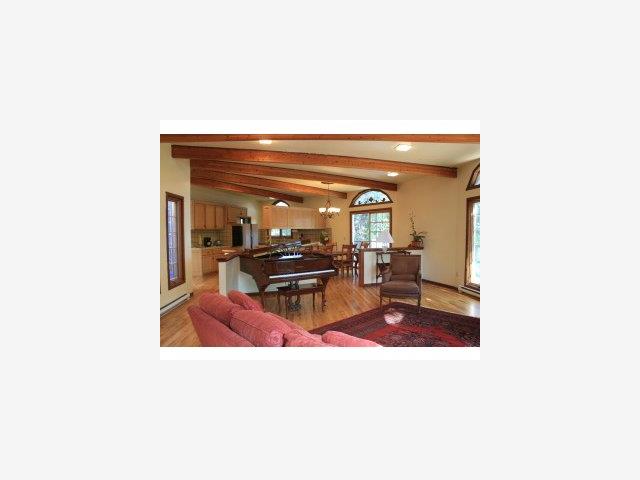 18692 Favre Ridge Road Los Gatos, CA 95033 - Photo 1 of 9 a living room with furniture and a clock