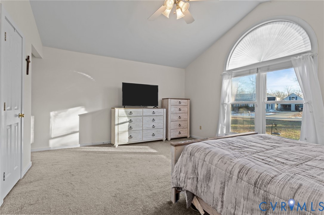 518 Rebel Ridge Road Colonial Heights, VA 23834 - Photo 33 of 44 a spacious bedroom with a bed and a flat tv screen on dresser