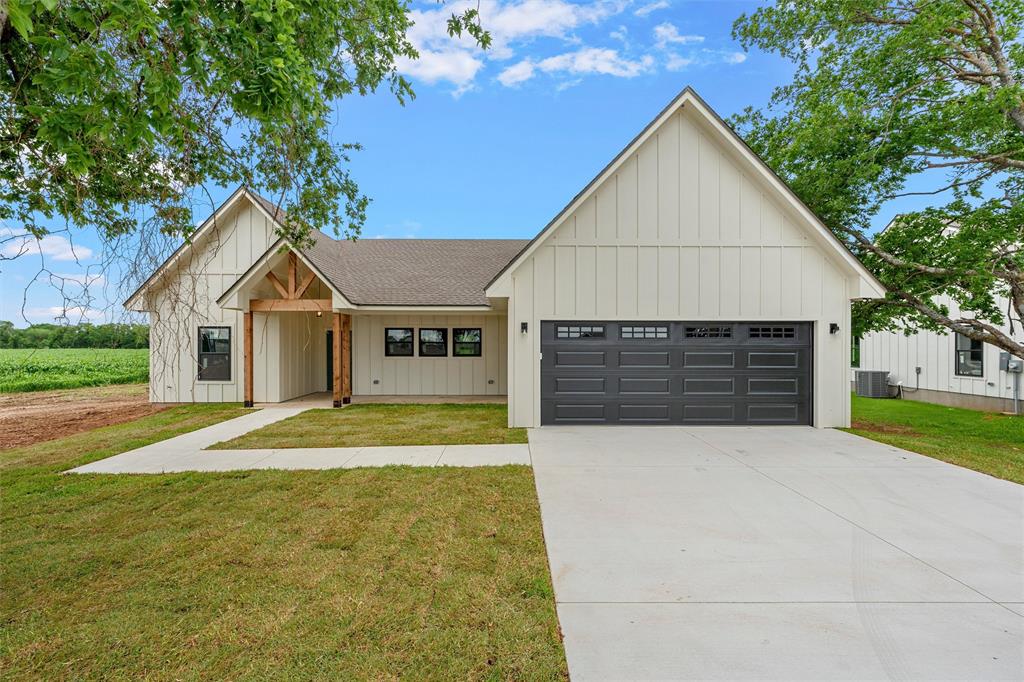 5200 Bogey Lane Waco, TX 76708 - Photo 2 of 37 a front view of a house with a yard and garage