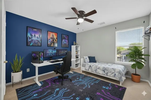 a bedroom with a workspace